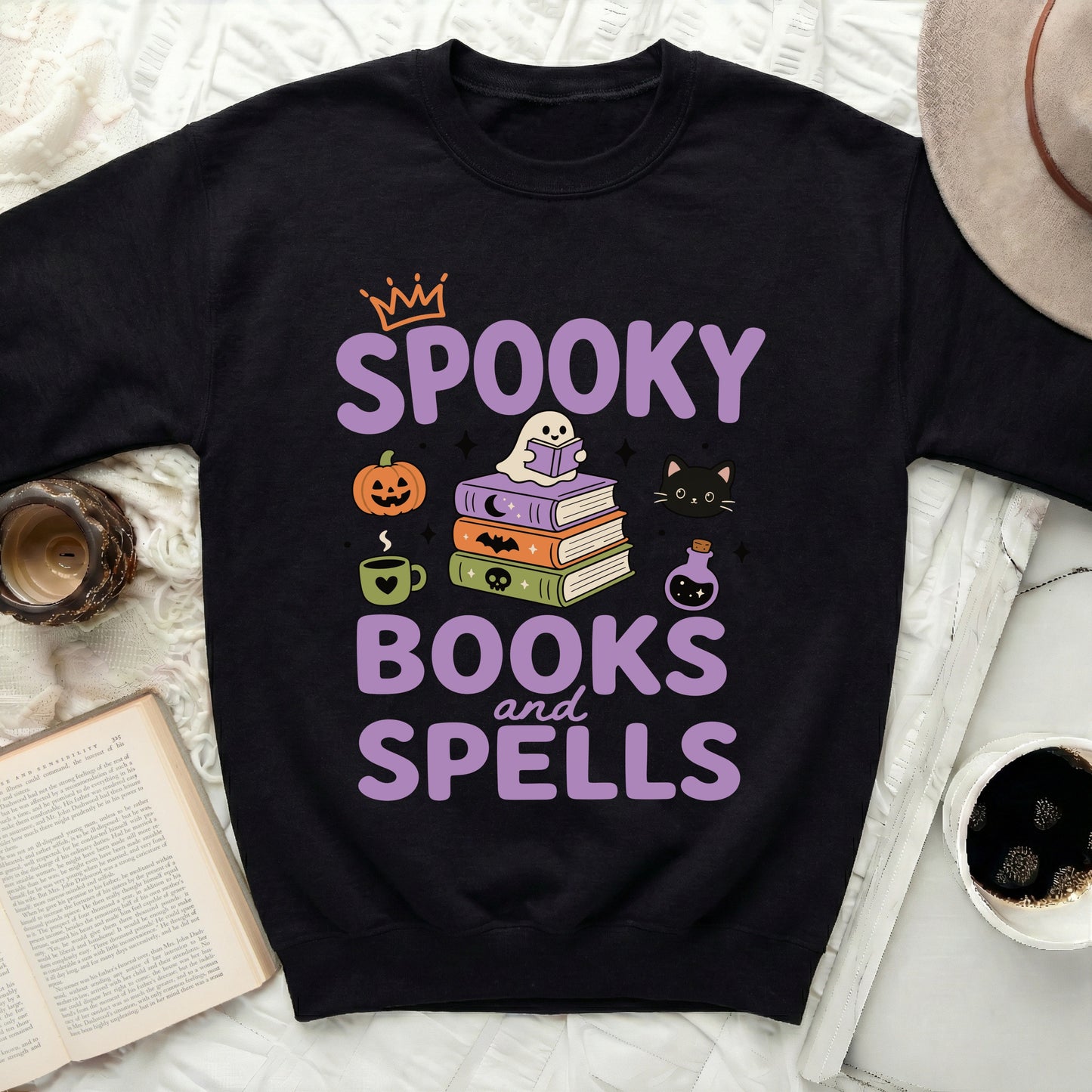Black sweatshirt with "Spooky Books and Spells" Halloween graphic.