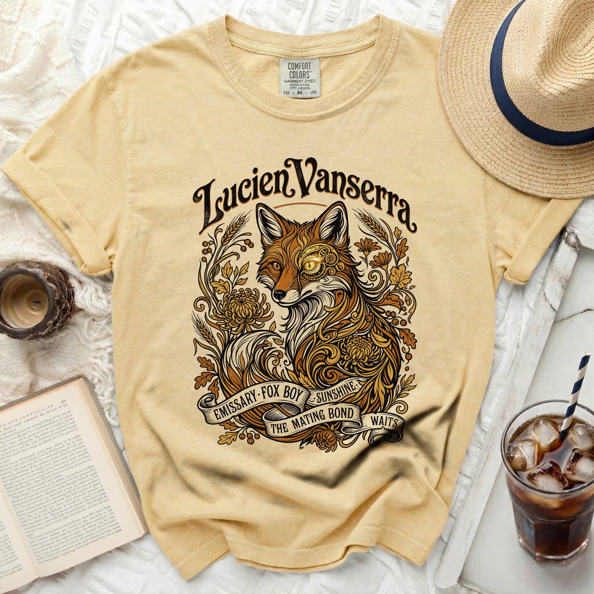 Yellow t-shirt with a graphic of a fox and decorative elements.