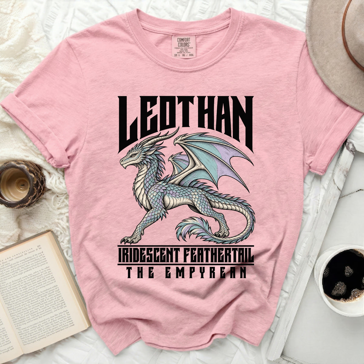Pink t-shirt with a dragon graphic and text "LEDTHAN IRIDESCENT FEATHERTAIL THE EMPYREAN".