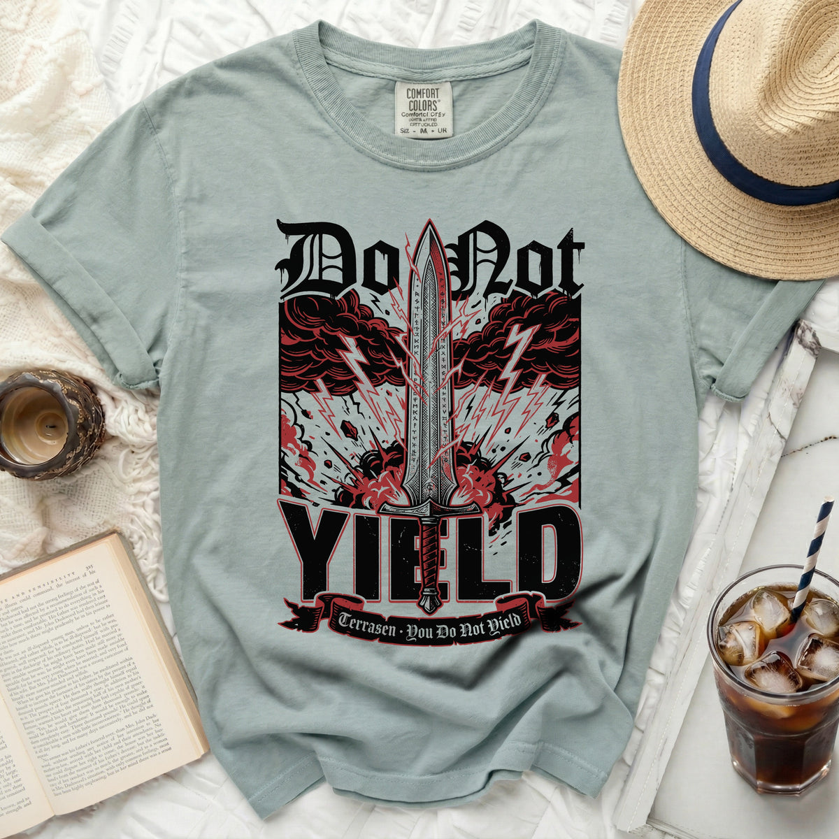 T-shirt with "Do Not Yield" sword graphic and quote.