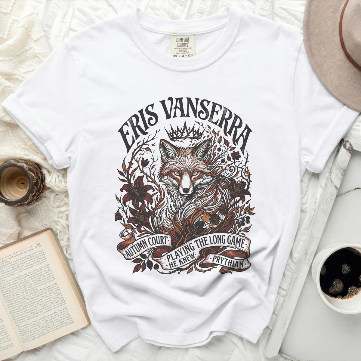 White t-shirt with a fox and foliage graphic and text "Eris Vanserra".