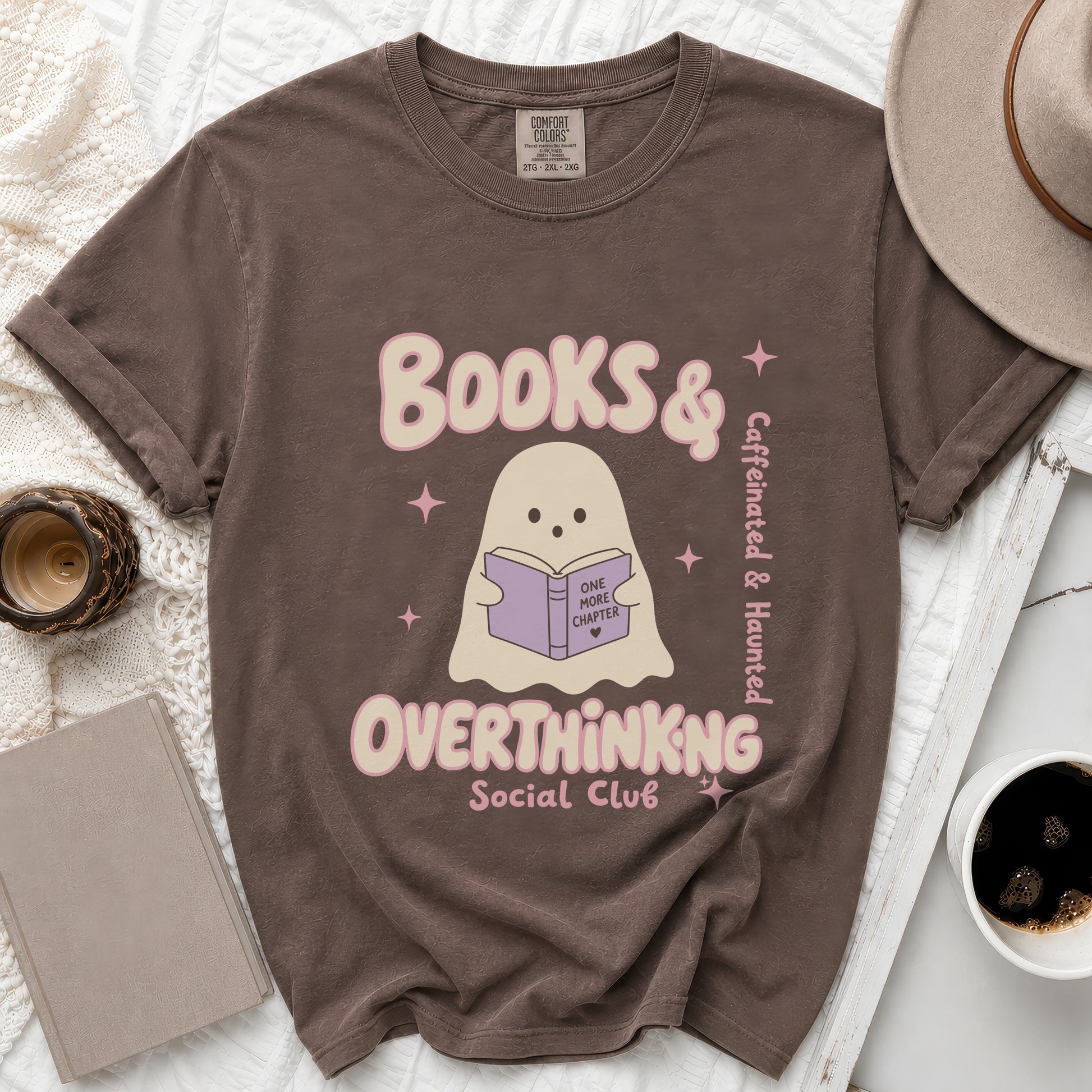 Brown t-shirt with ghost and text: "Books & Caffeinated & Haunted Overthinking Social Club".