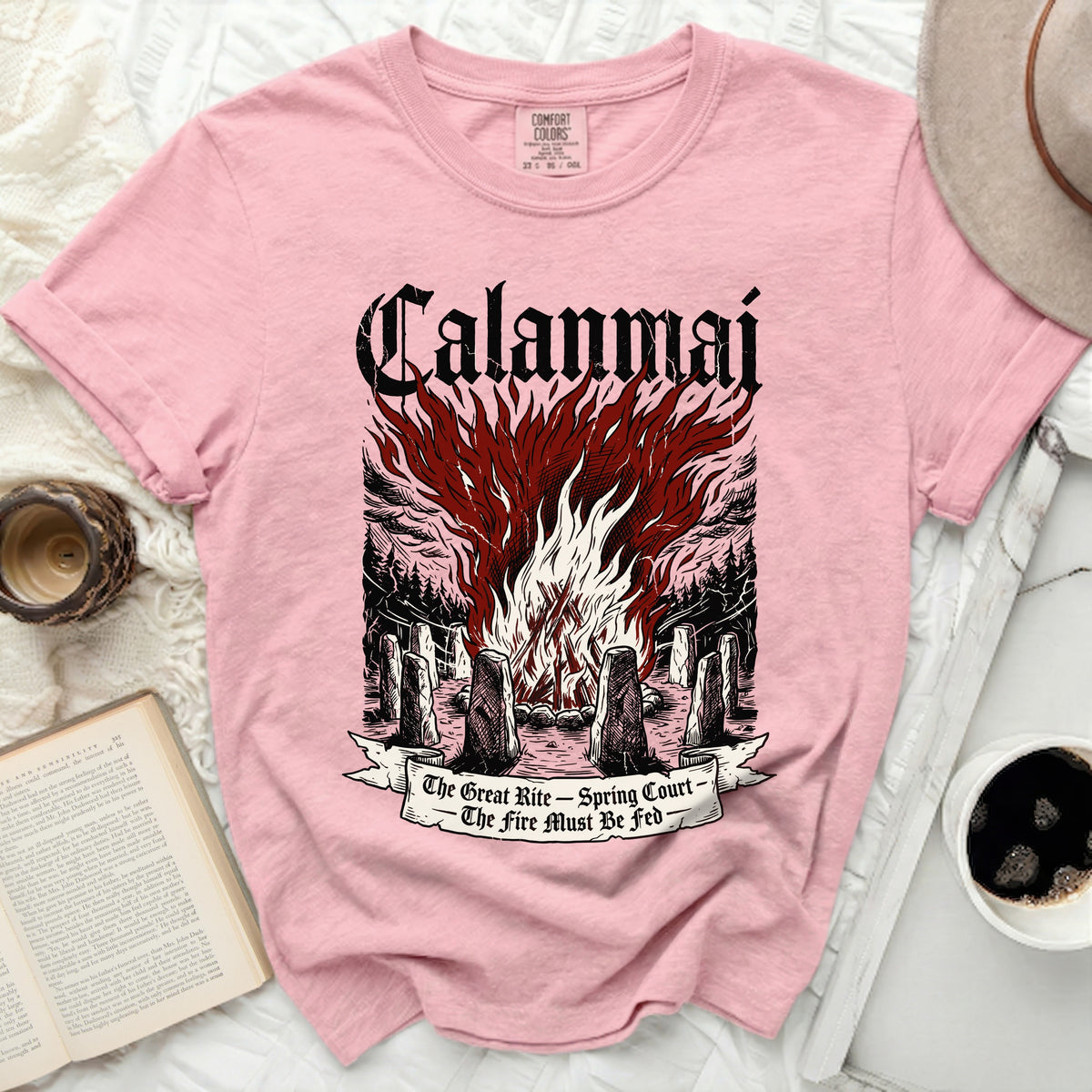 Pink t-shirt with "Calamnai" and a bonfire illustration. "The Great Rite - Spring Court - The fire must be fed" text.