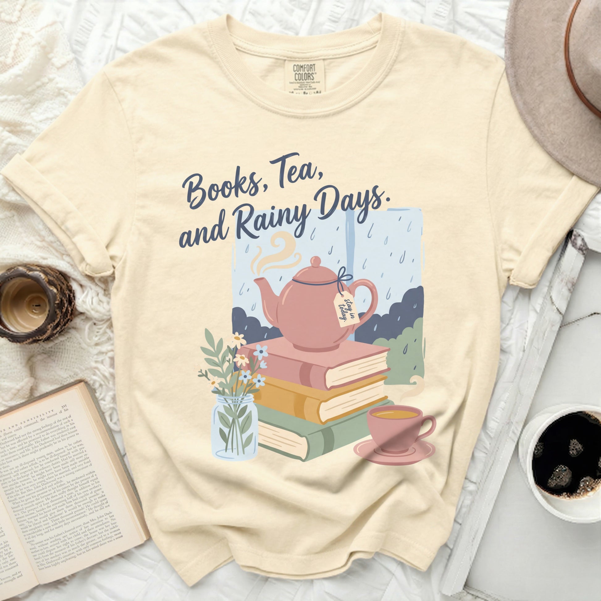 Cream t-shirt with "Books, Tea, and Rainy Days" text and illustration.
