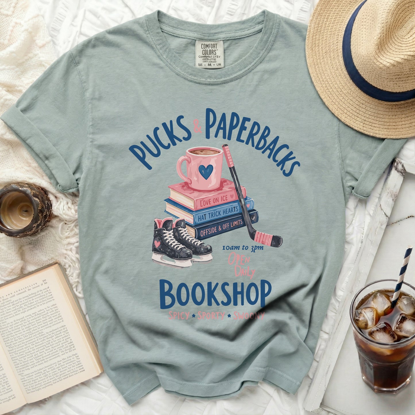 "Pucks & Paperbacks" bookshop graphic with hockey skates and ice hockey pucks.