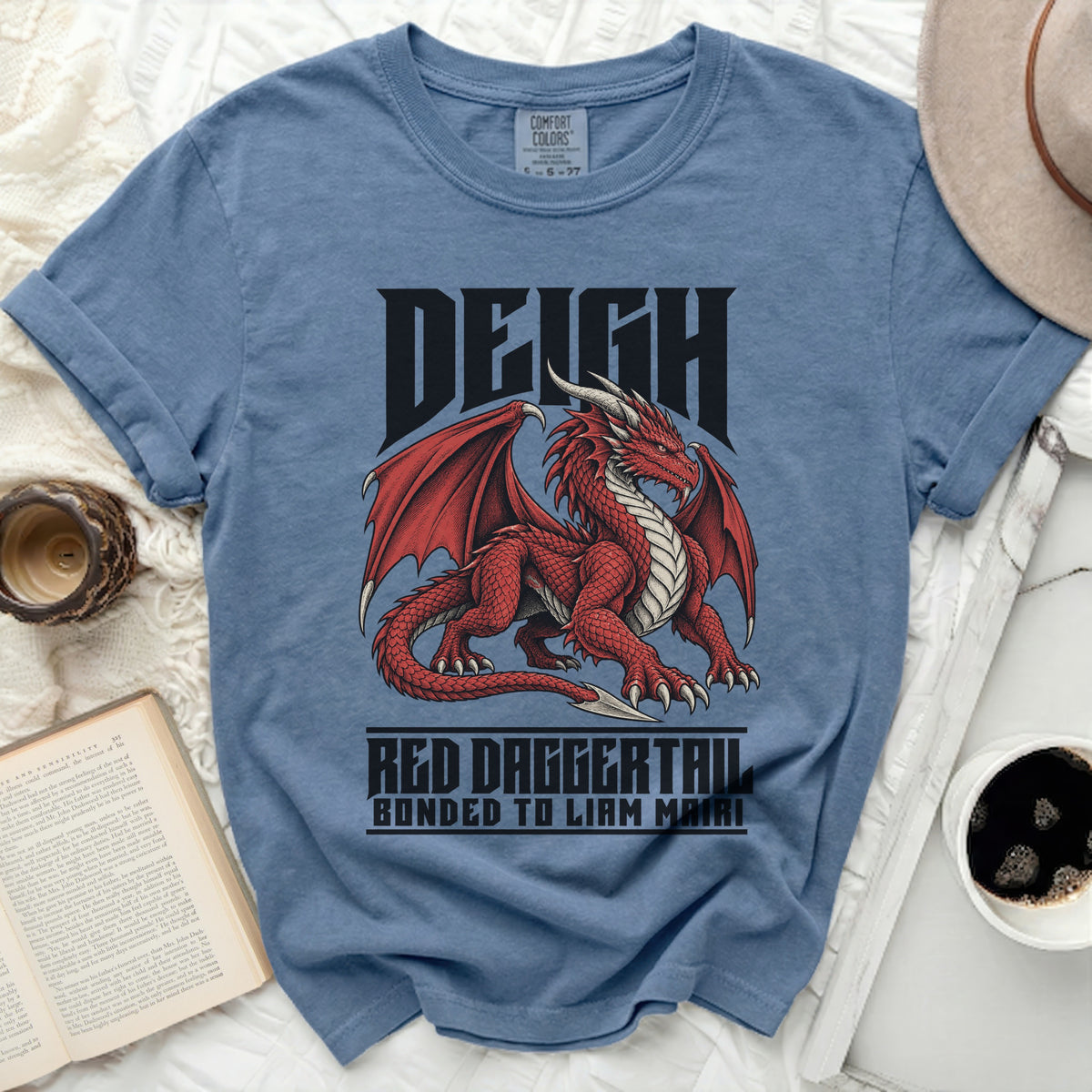 Blue t-shirt with a red dragon graphic and text "DEIGH" and "RED DAGGERTAIL BONDED TO LIAM MAIRI".