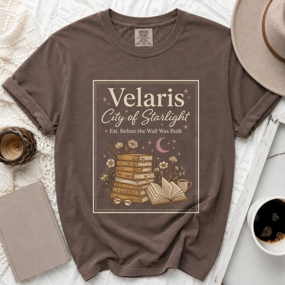 T-shirt with "Velaris City of Starlight" and book illustration.