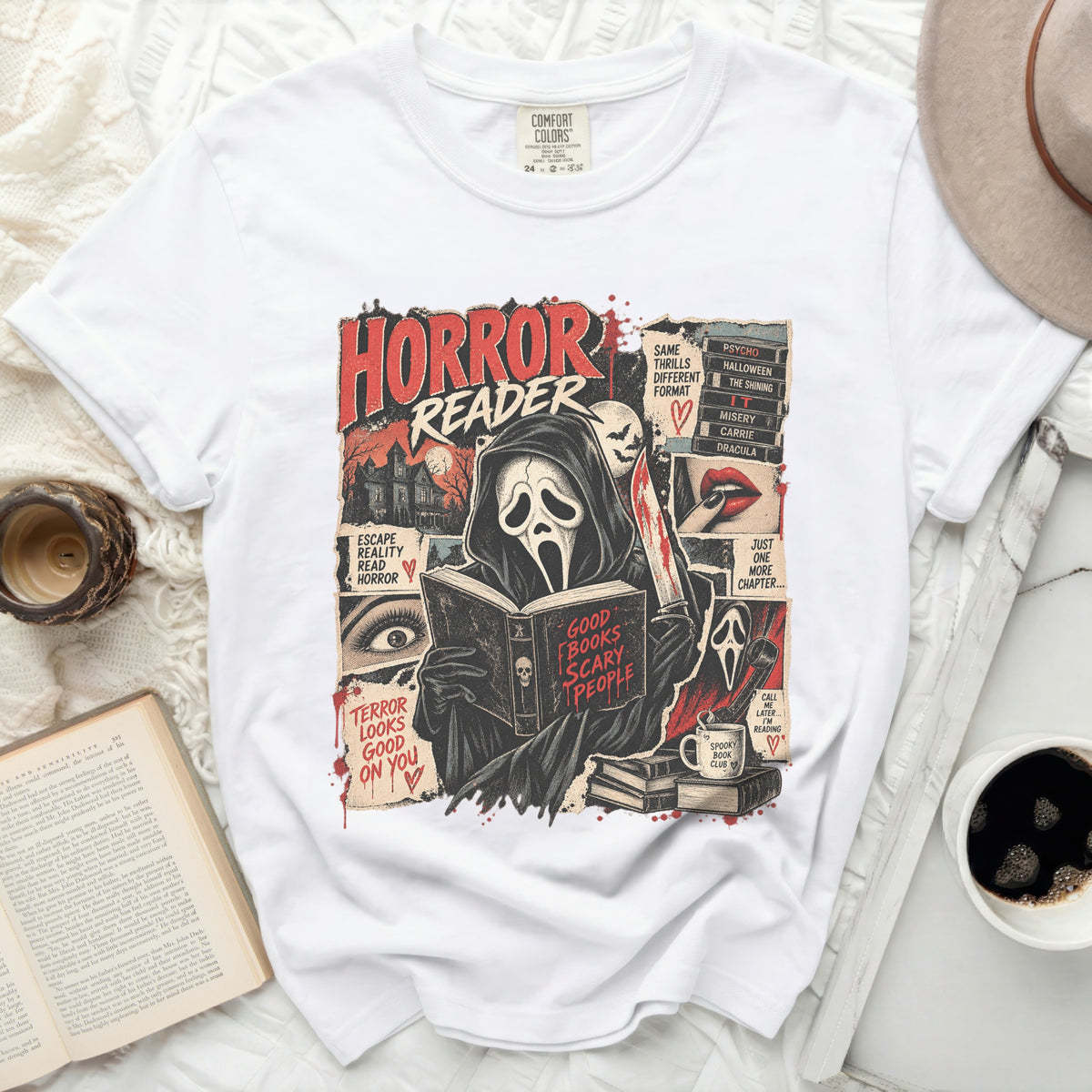 White t-shirt with "Horror Reader" graphic featuring a masked figure reading a book.