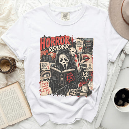 White t-shirt with "Horror Reader" graphic featuring a masked figure reading a book.