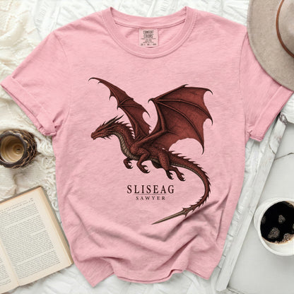 Pink t-shirt with a red dragon graphic and text "SLISEAG SAWYER".