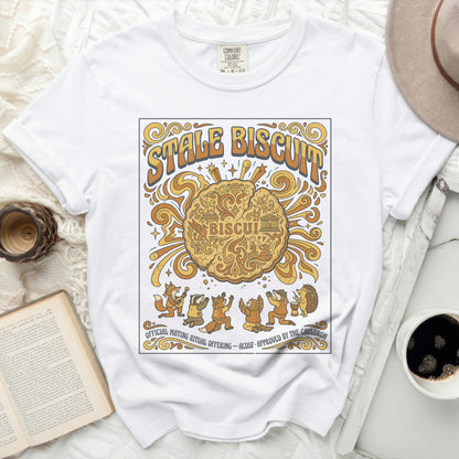 White t-shirt with "STALE BISCUIT" and woodland creatures performing a ritual.