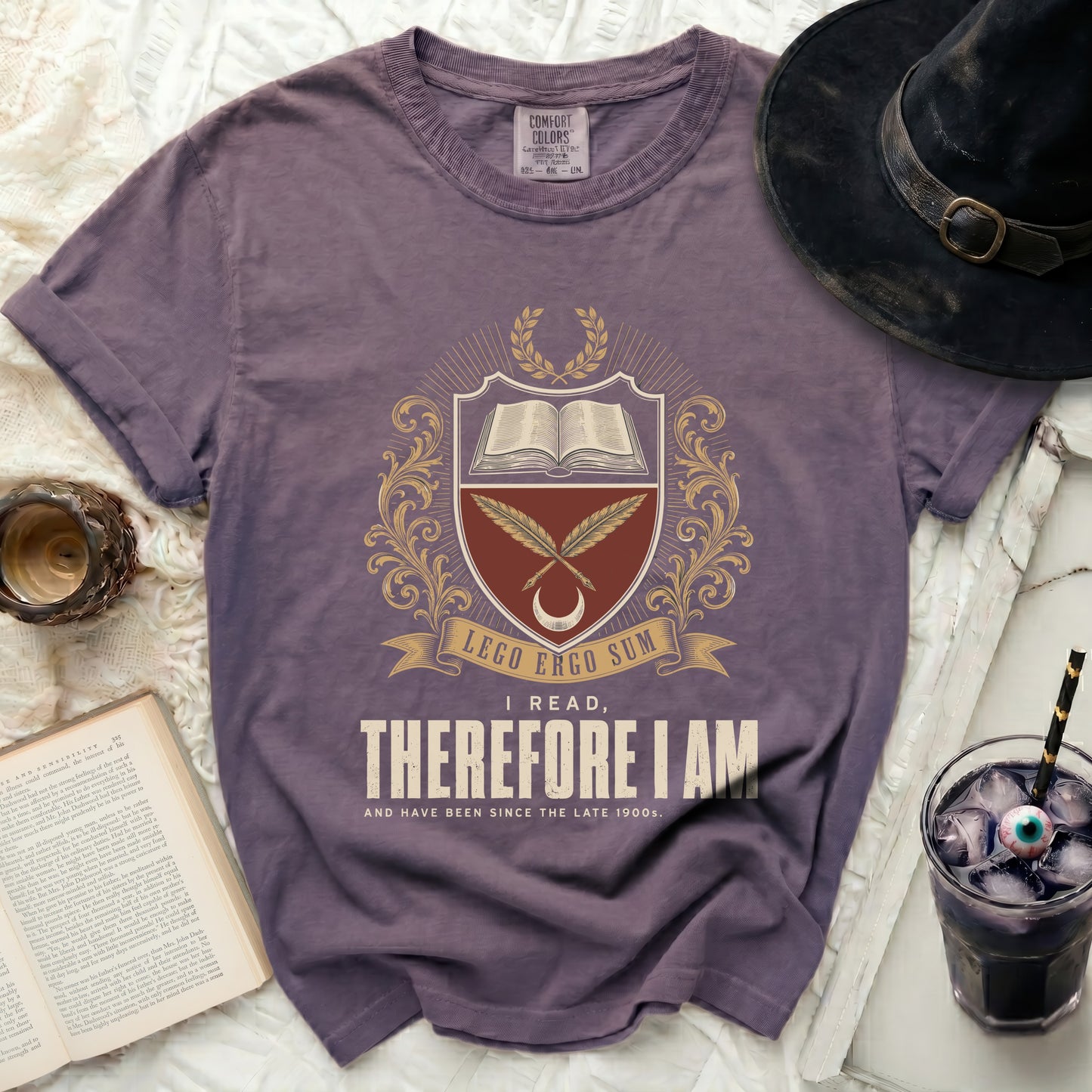 Purple t-shirt with "I Read, Therefore I Am" and Latin text graphic.
