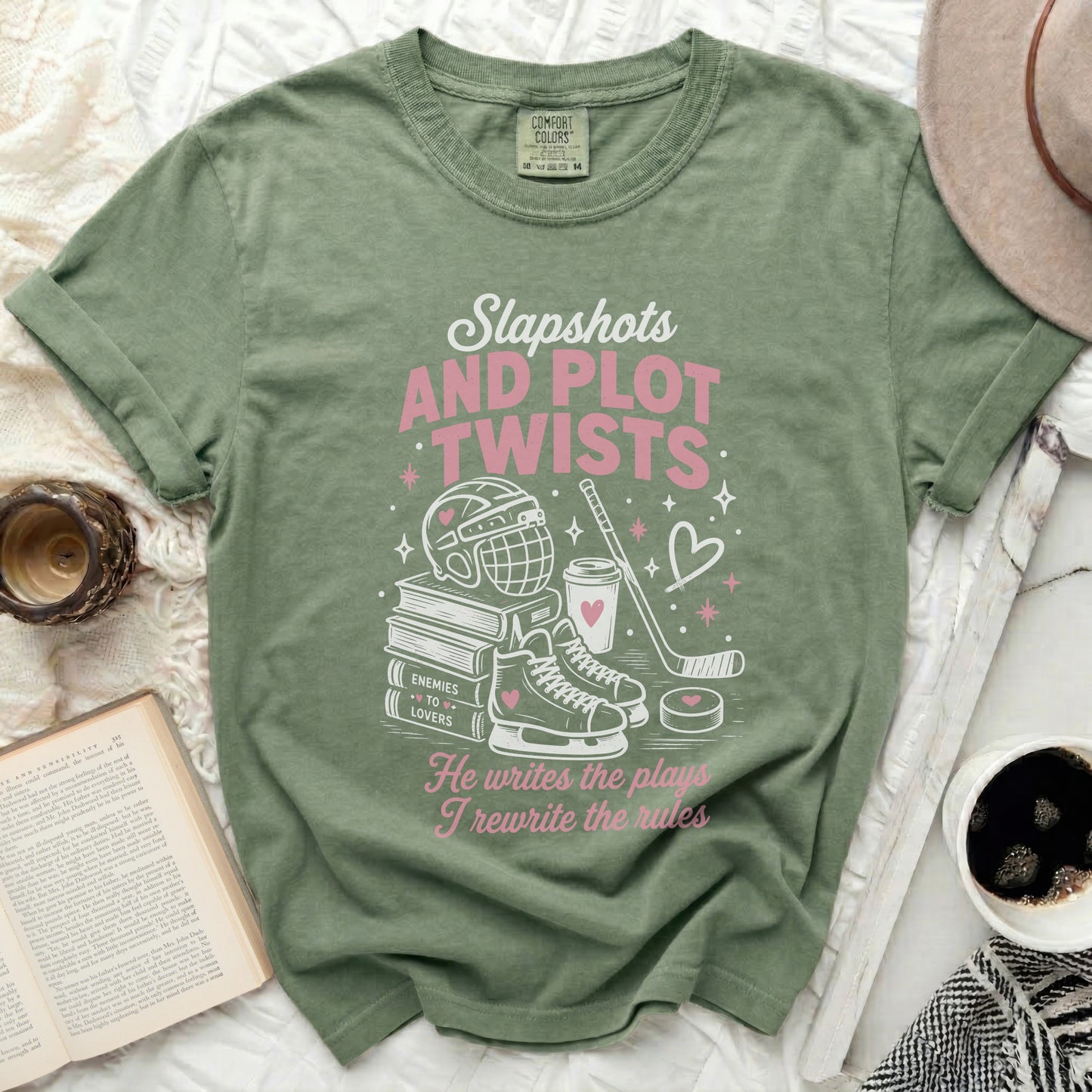 Green t-shirt with "Slapshots and Plot Twists" text and hockey imagery.