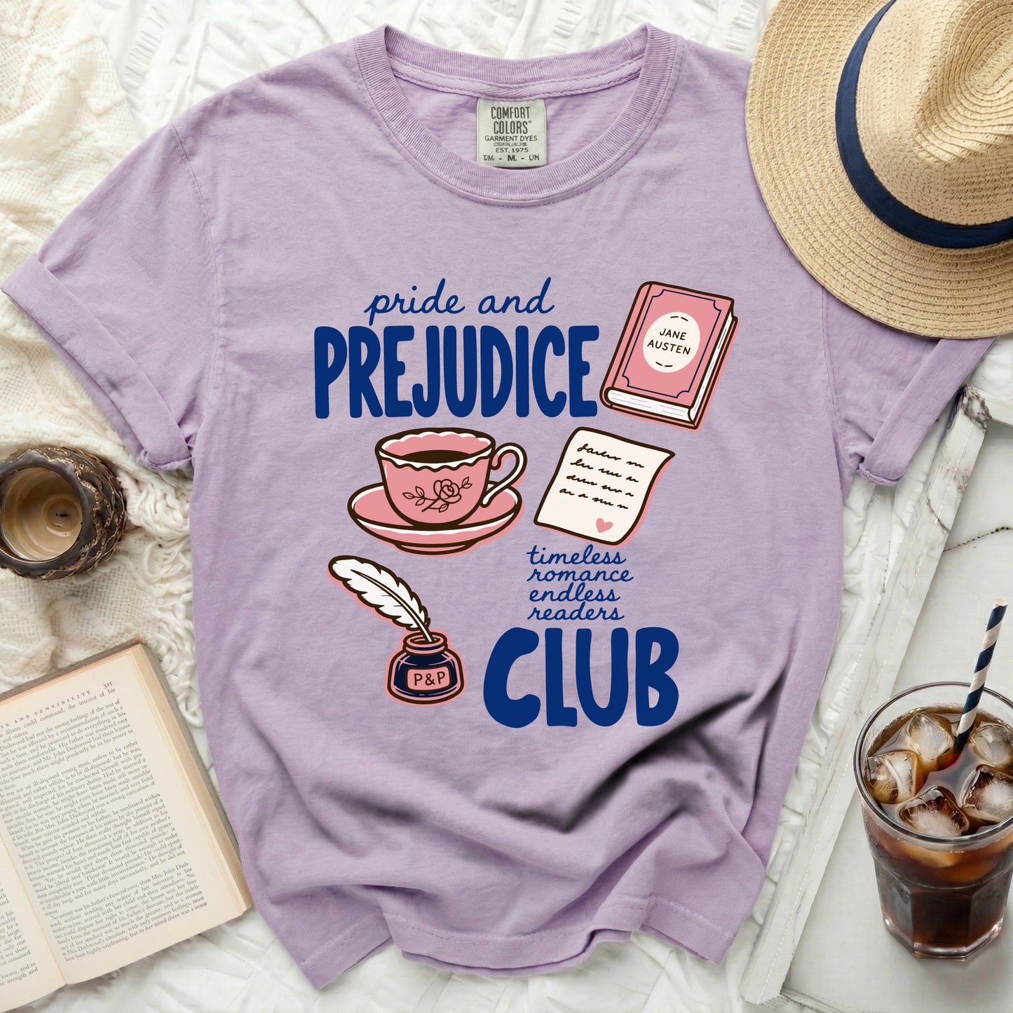 Purple t-shirt with "Pride and Prejudice" book club graphics.