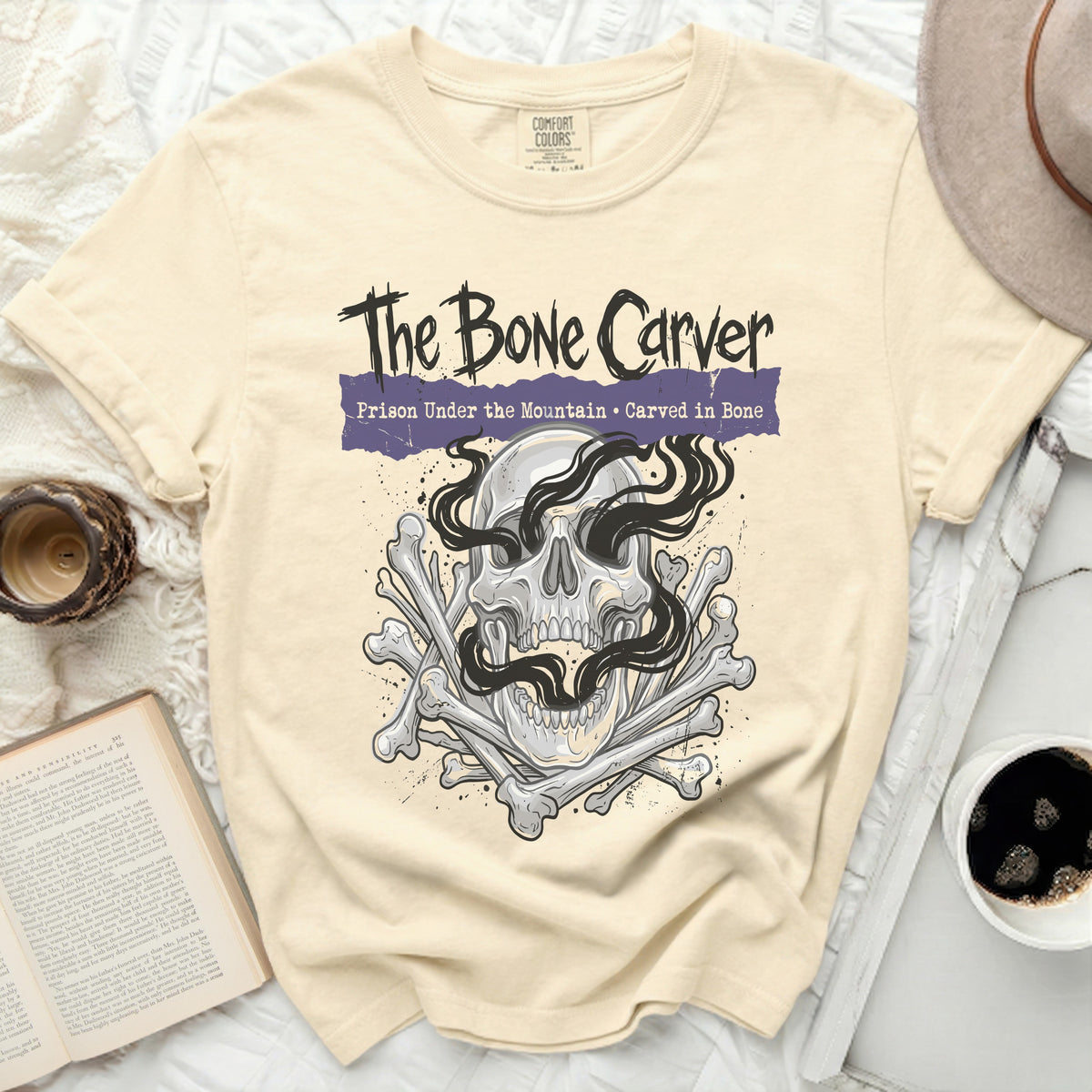 The Bone Carver graphic t-shirt with skull and bones.