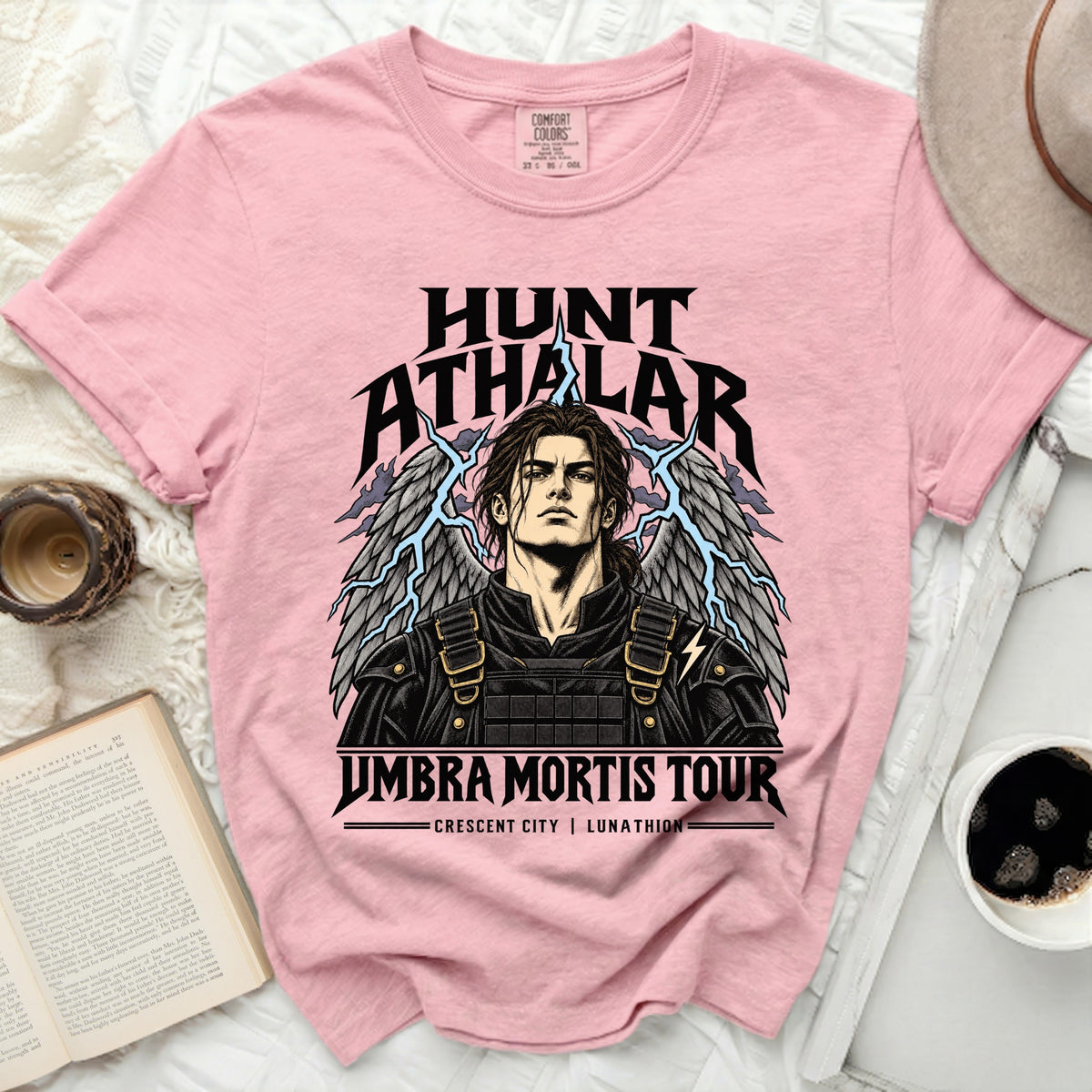 Pink t-shirt featuring Hunt Athalar with wings and lightning, and "Umbra Mortis Tour" text.