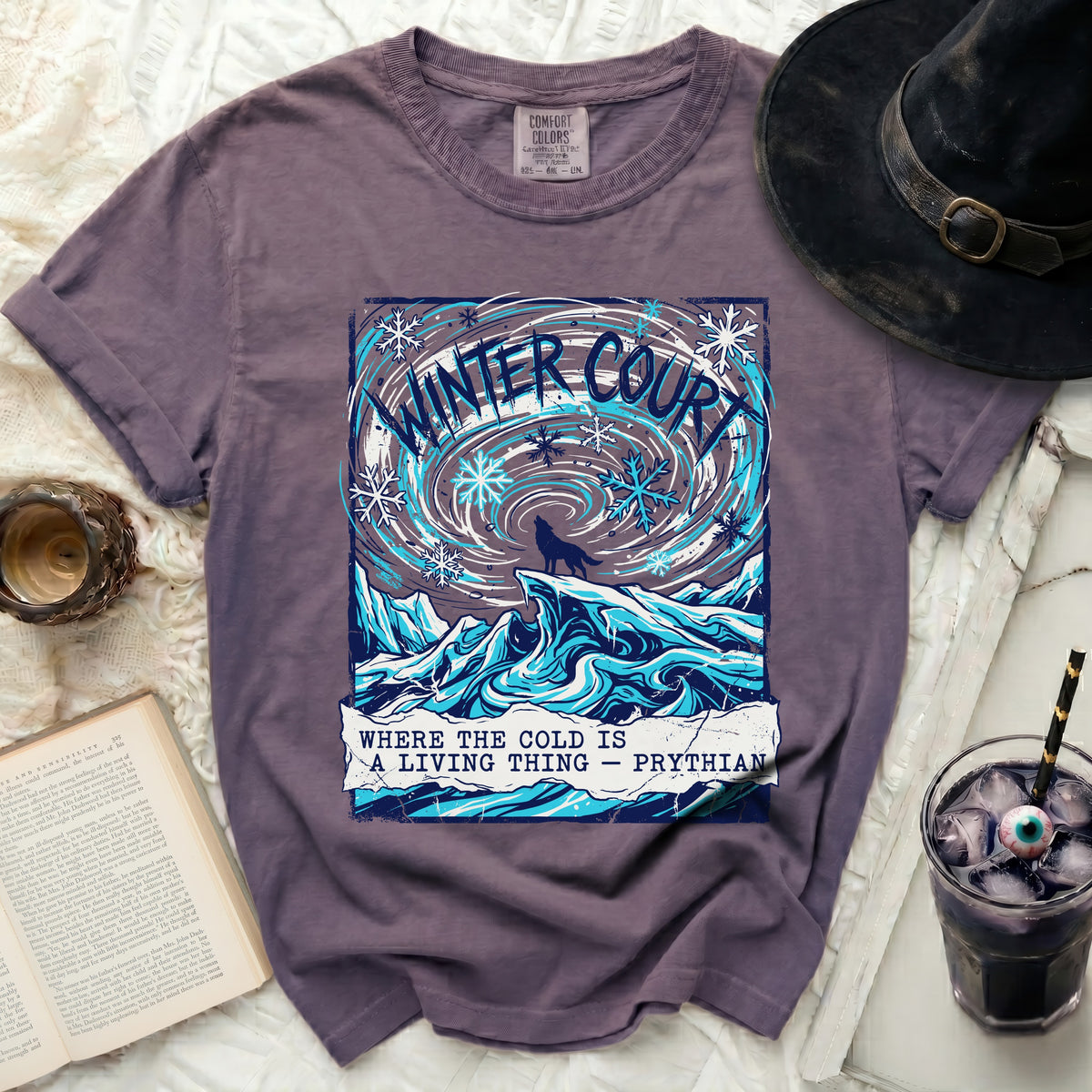 Purple shirt with "Winter Court" graphic and wolf on icy landscape.