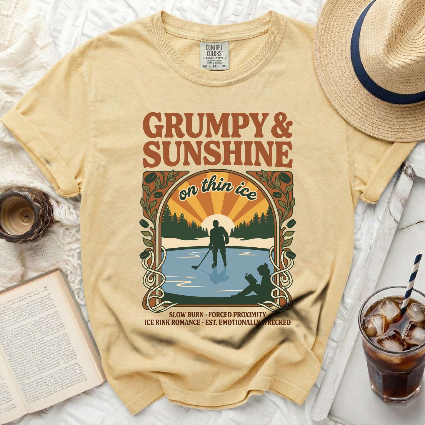 Yellow t-shirt with "Grumpy & Sunshine on thin ice" graphic of ice skater.