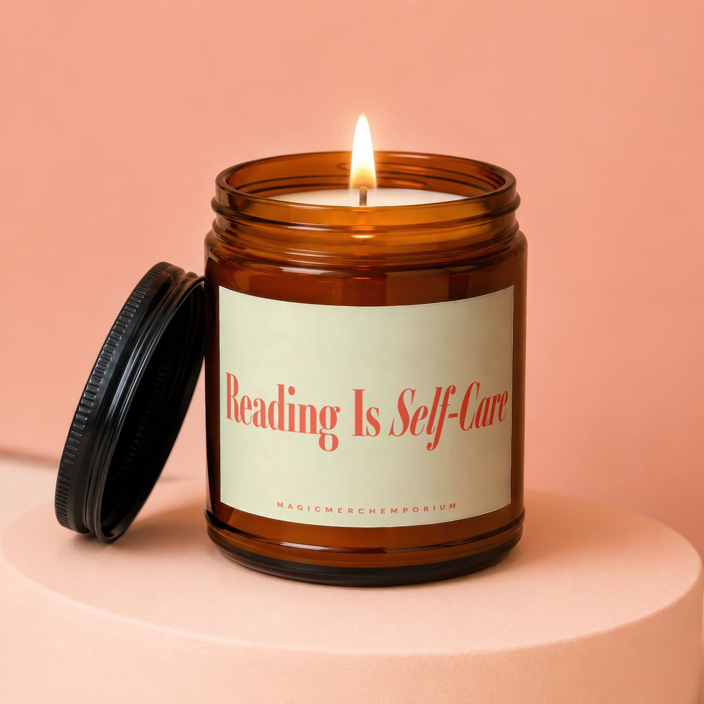 Amber jar candle with lit wick and lid nearby, reading "Reading Is Self-Care".