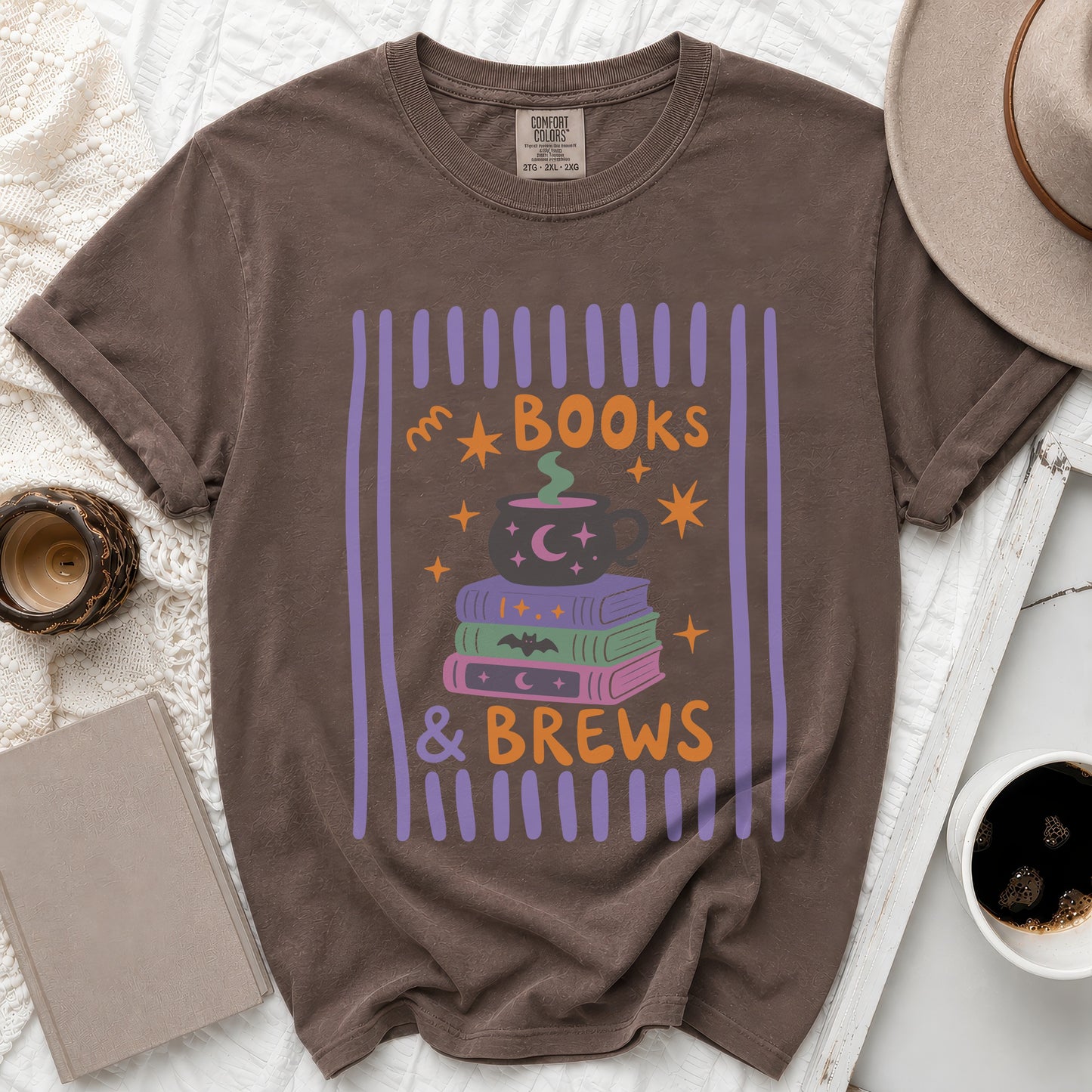 Brown t-shirt with "BOOKS & BREWS" text and Halloween-themed graphic.