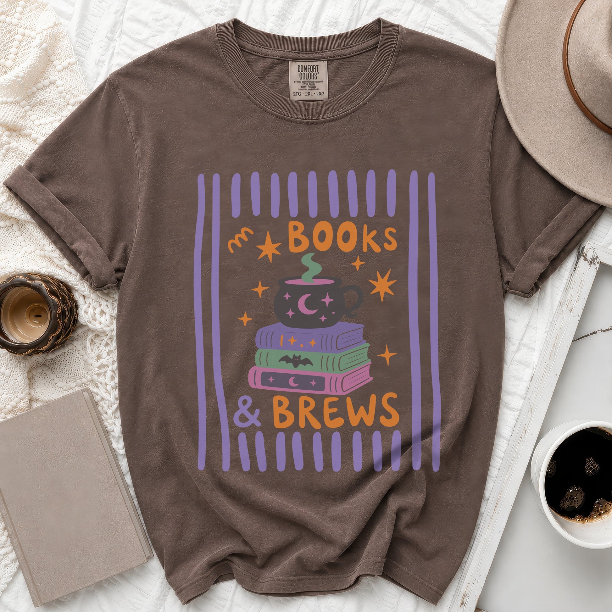Brown t-shirt with "BOOKS & BREWS" text and Halloween-themed graphic.
