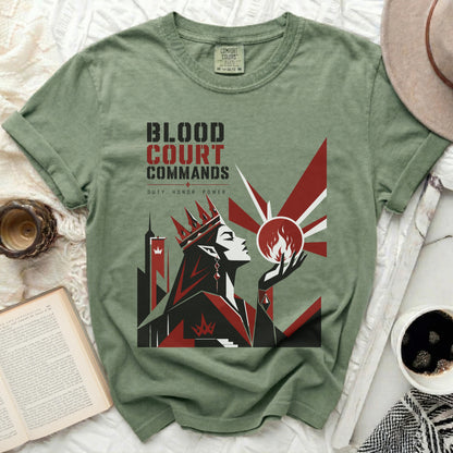 T-shirt with "Blood Court Commands" graphic and a crowned figure.