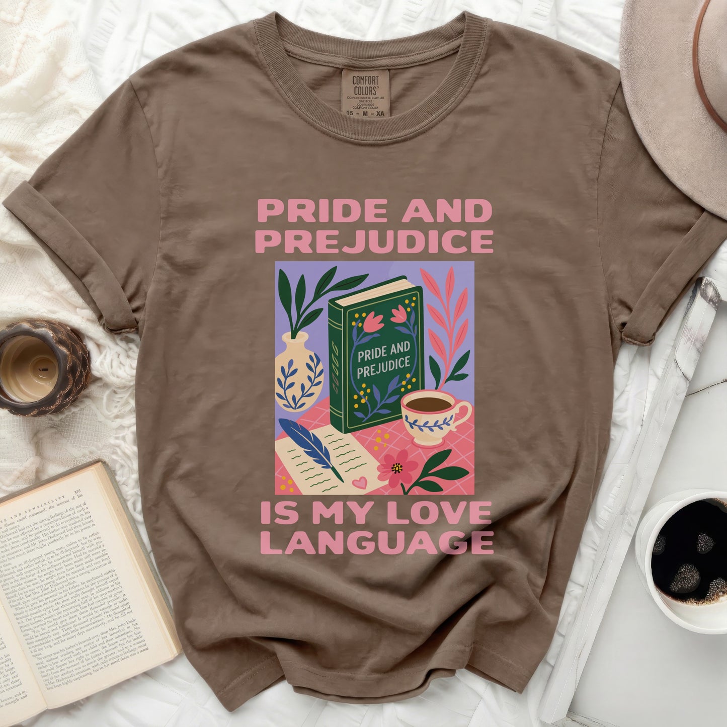 Brown t-shirt with "Pride and Prejudice Is My Love Language" graphic.