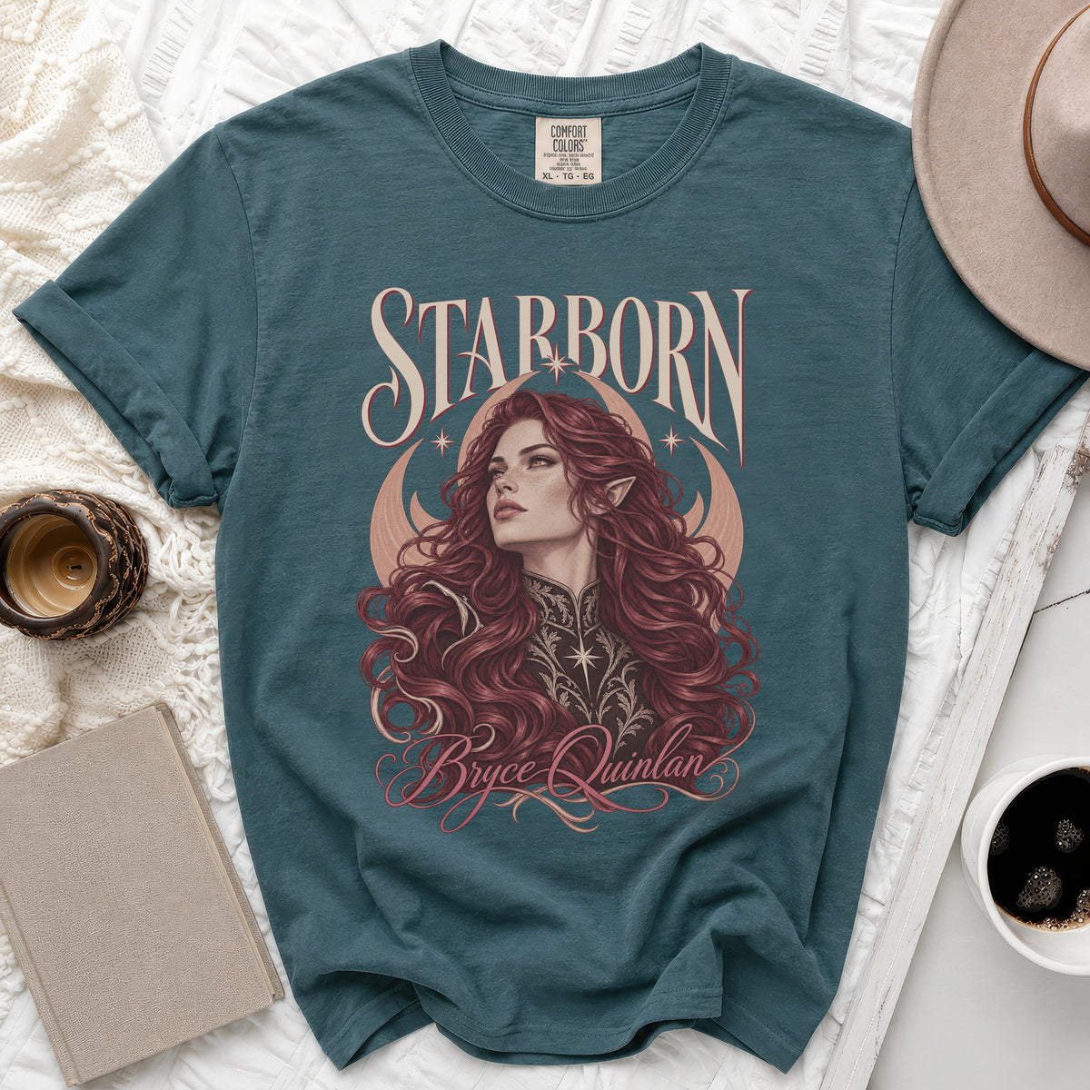 Teal t-shirt with "Starborn Bryce Quinlan" text and fantasy art.