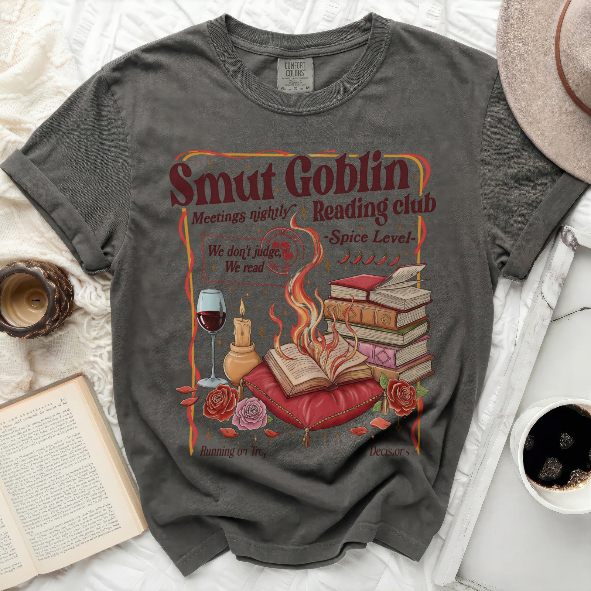 Smut Goblin Reading Club t-shirt with flame, books, roses, and wine graphic.