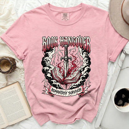 Pink t-shirt with "Book Hangover" and "Romantasy Survivor" text.