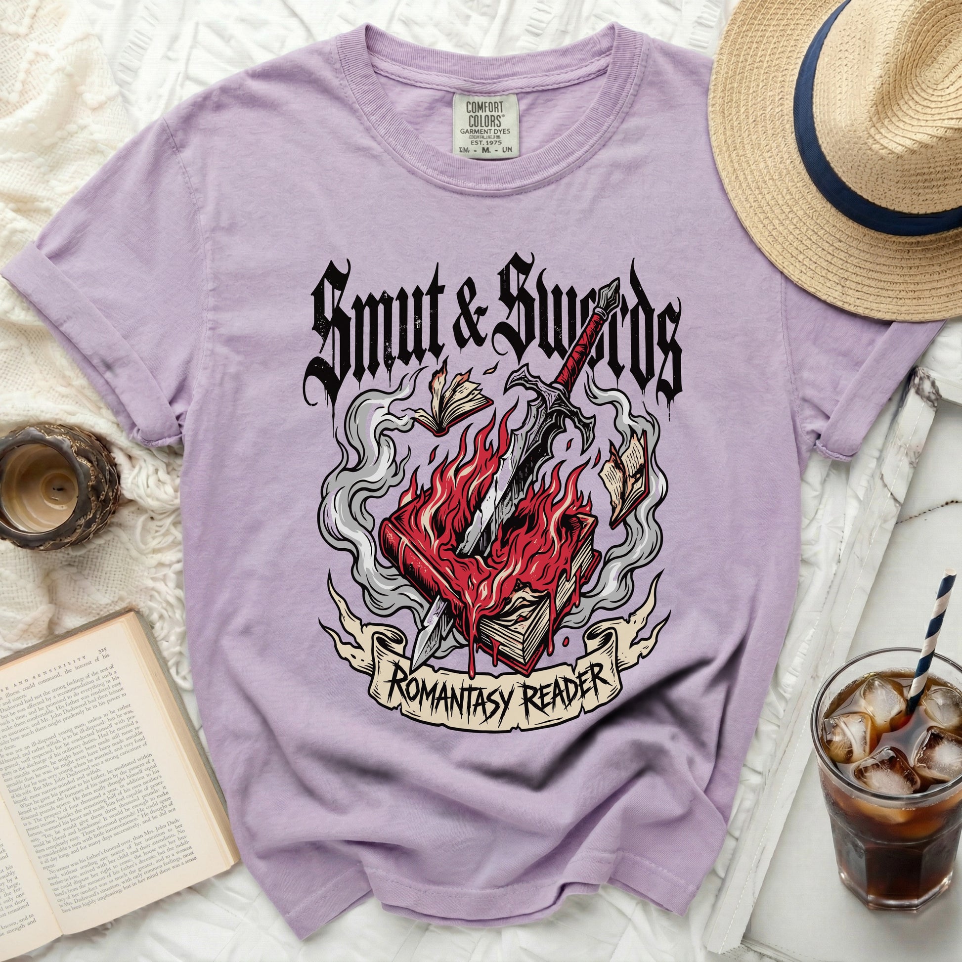 Lilac t-shirt with "Smut & Swords" and "Romantasy Reader" graphic.