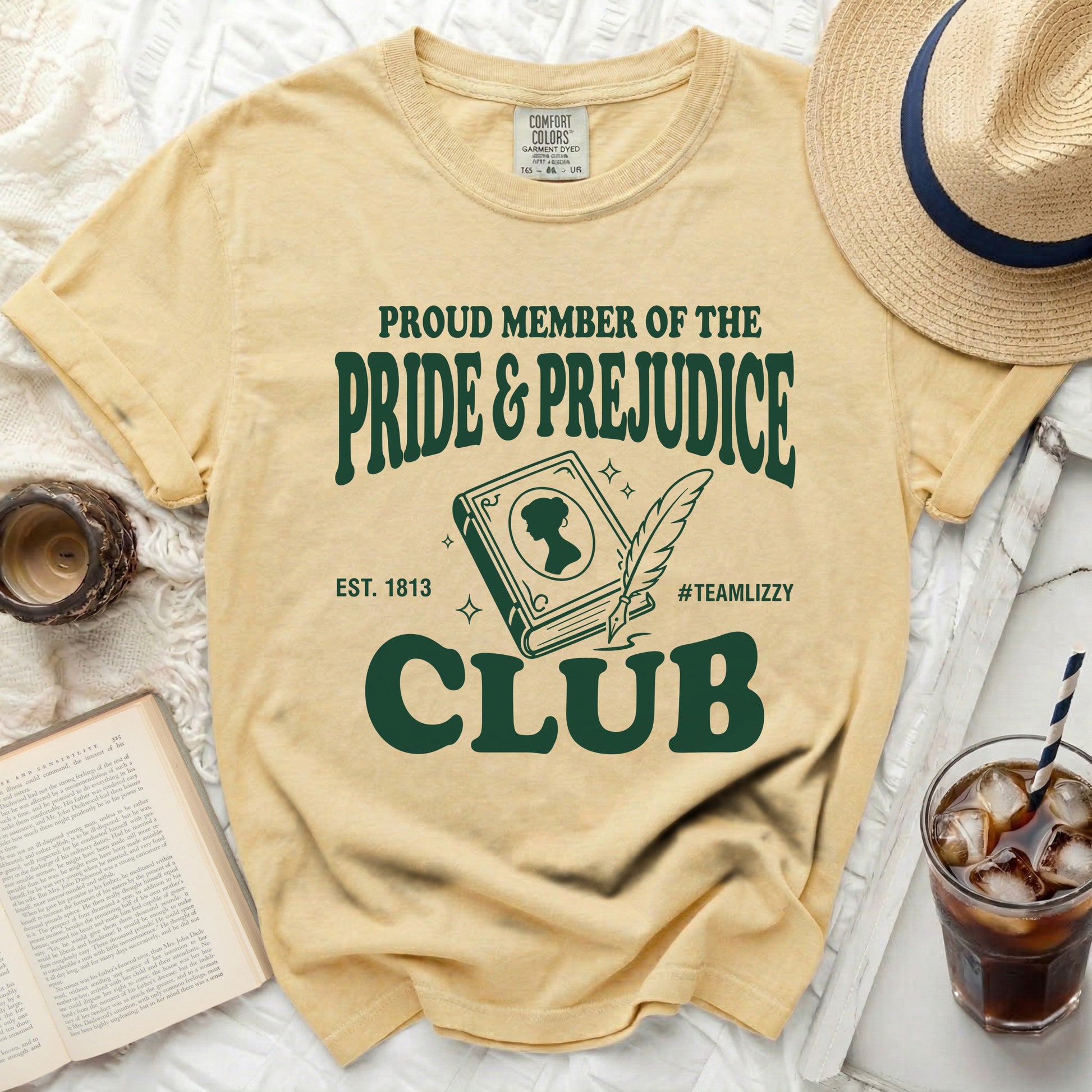 Yellow t-shirt with "Proud Member of the Pride & Prejudice Club" text.