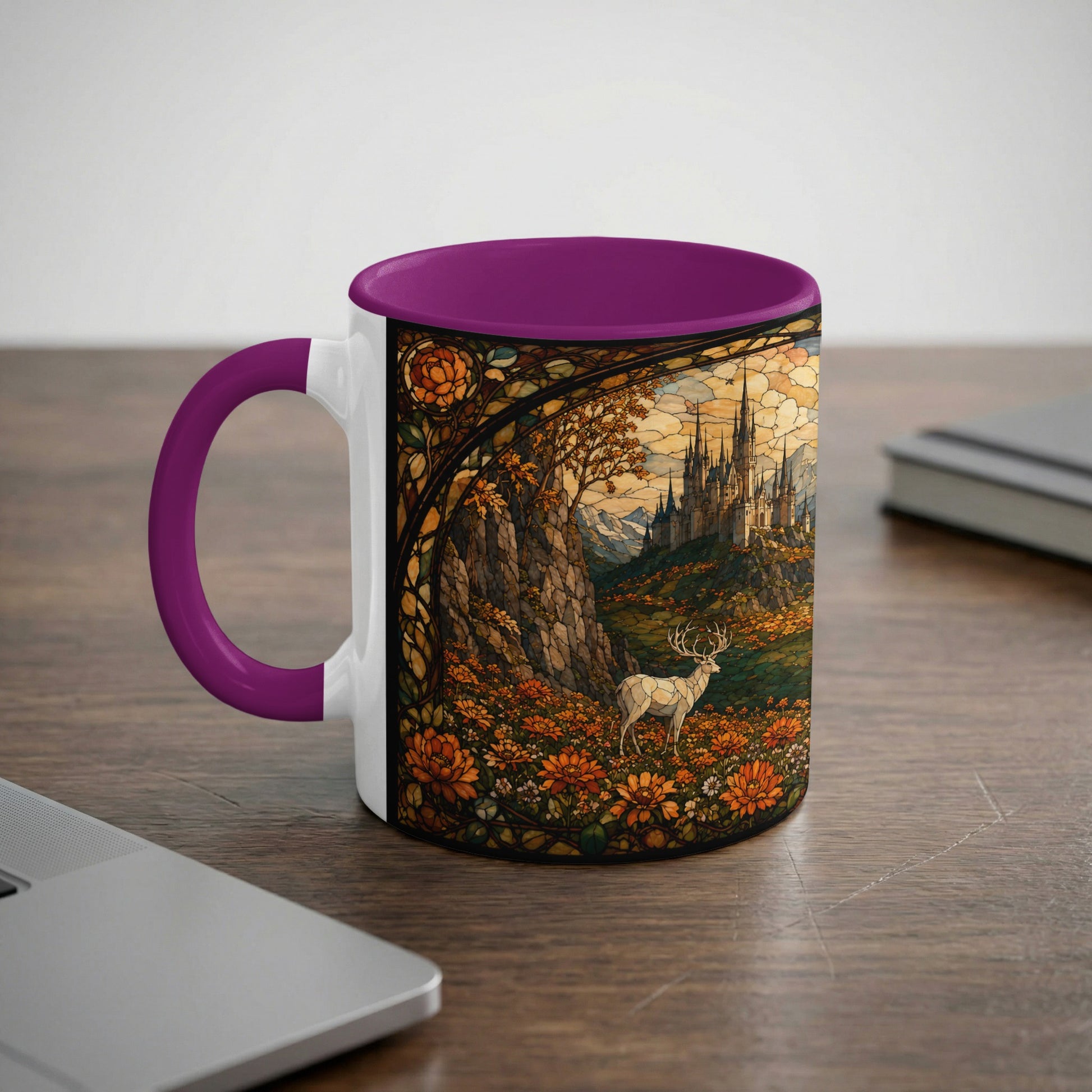A white mug with a purple handle displays a stained glass scene of a castle and deer.