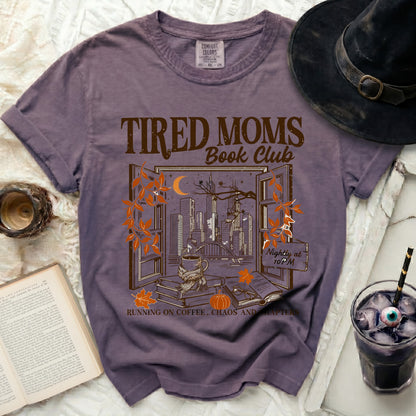 Tired Moms Book Club graphic tee with city view and coffee.