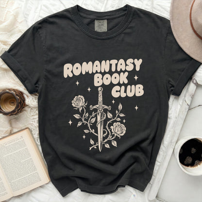 Black t-shirt with a cream graphic of a sword tangled in roses.