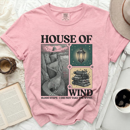 Pink t-shirt with "HOUSE OF WIND" and stair graphic.