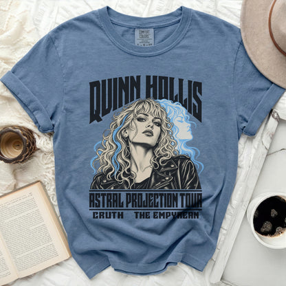 Blue t-shirt with Quinn Hollis "Astral Projection Tour" graphic featuring a woman.