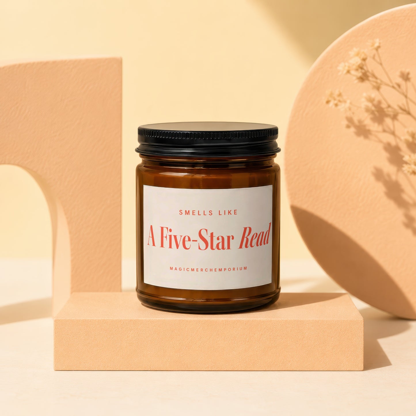 Amber jar candle with a black lid labeled "A Five-Star Read".
