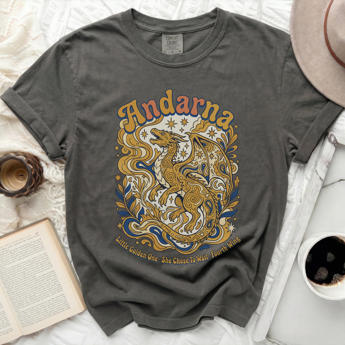 Charcoal t-shirt with a golden dragon and text "Andarna" and "Little Golden One. She Chose To Wait Fourth Wing."