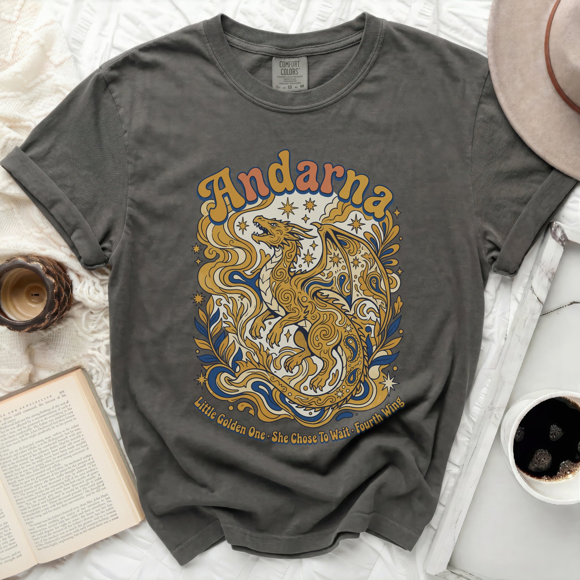 Charcoal t-shirt with a golden dragon and text "Andarna" and "Little Golden One. She Chose To Wait Fourth Wing."