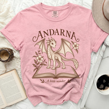 Pink t-shirt with "ANDARNA A little wonder" text and a dragon illustration.