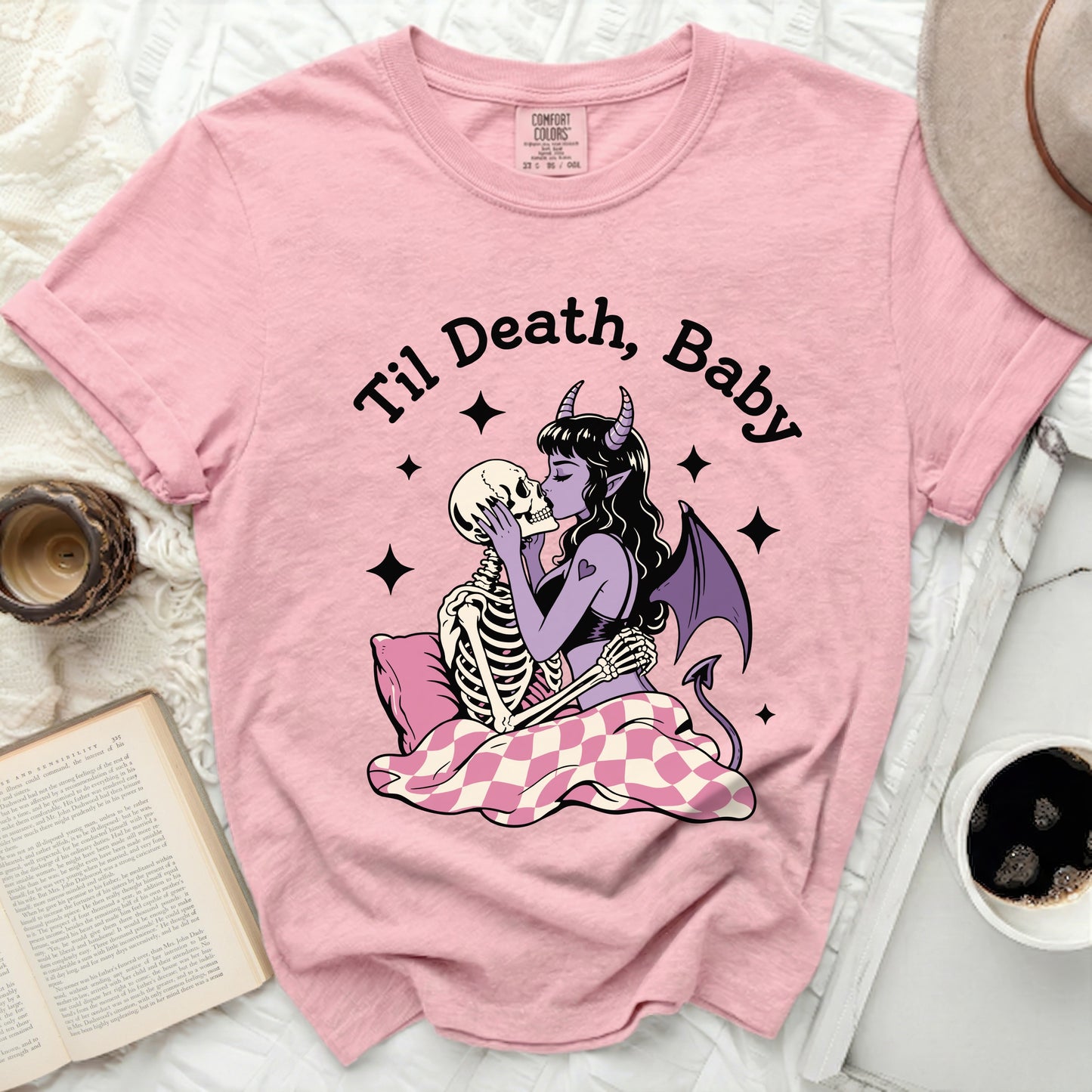 Pink t-shirt with skeleton couple embracing and "Til Death, Baby" text.