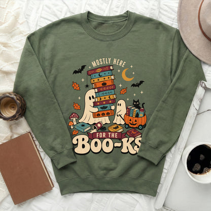 Green sweatshirt with ghosts, books, bats, and the text "Mostly Here for the Boo-Ks."