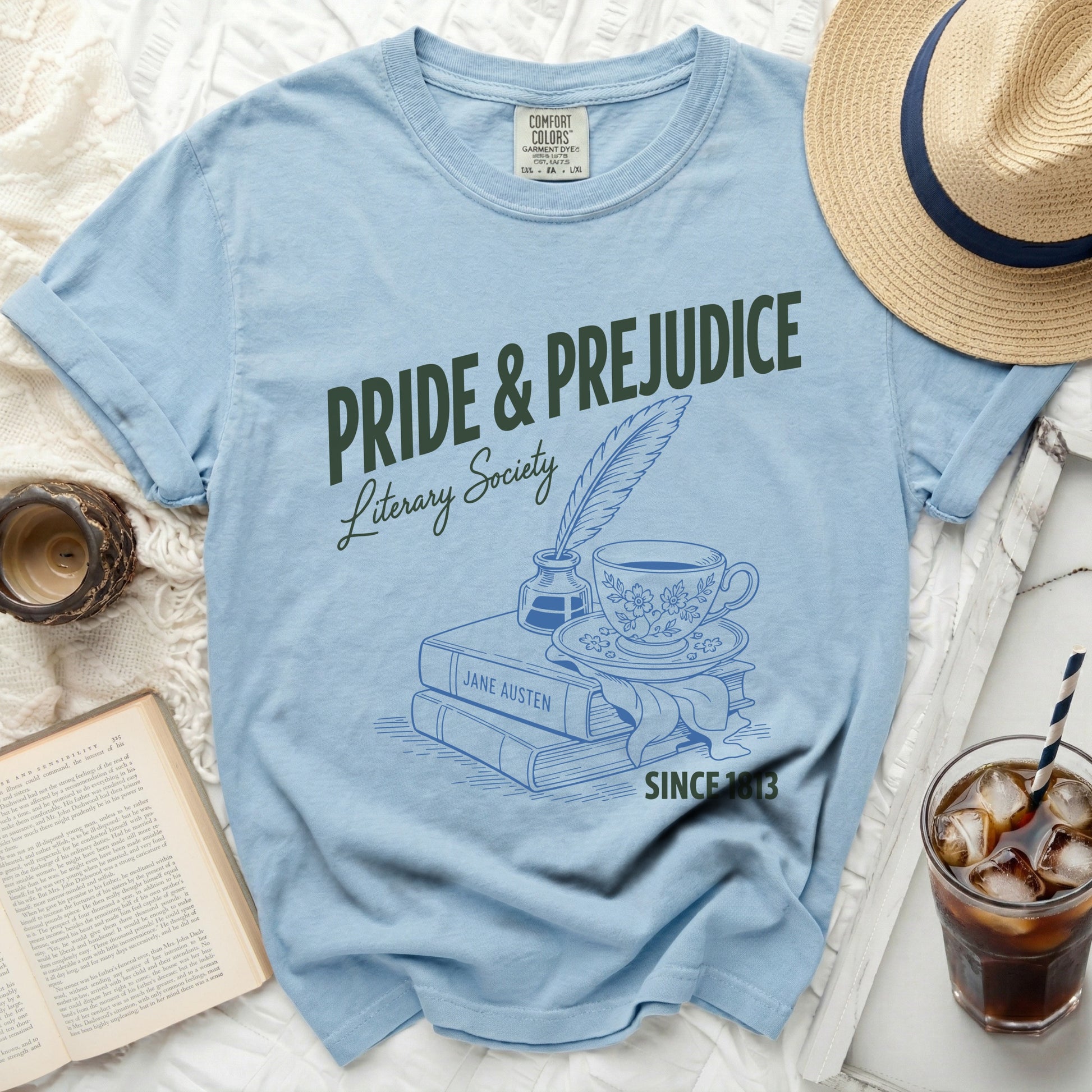 Light blue t-shirt with "Pride & Prejudice Literary Society" graphic.