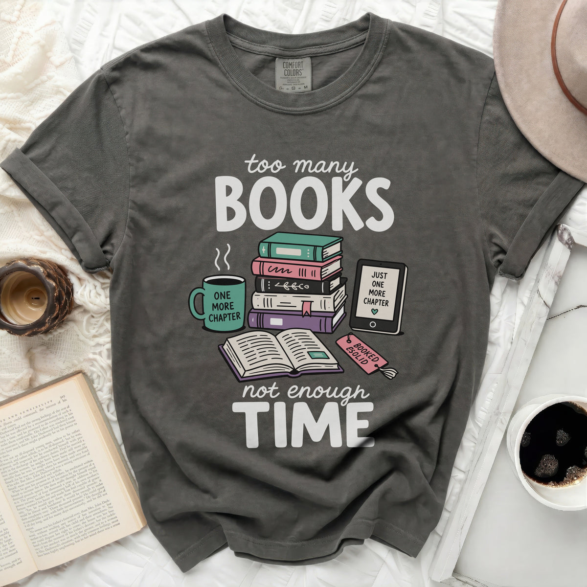 T-shirt with "too many BOOKS, not enough TIME" graphic and book illustrations.