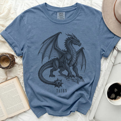 Blue t-shirt with a black dragon graphic and the text "TAIRN" below.