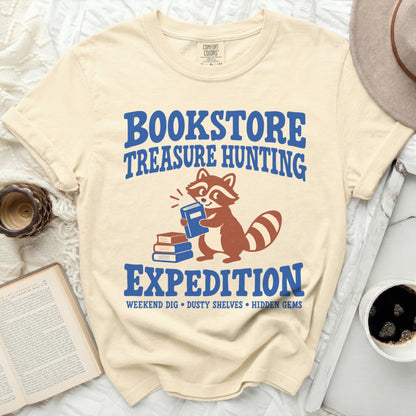Bookstore Treasure Hunting Expedition with raccoon graphic and book icons.
