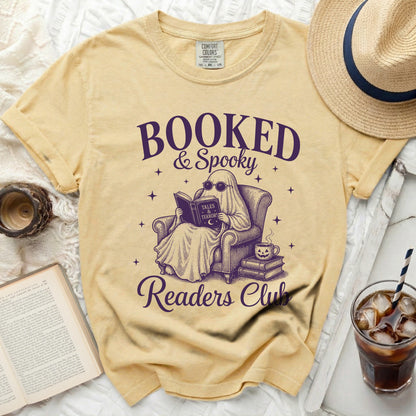 Booked & Spooky Readers Club graphic tee with ghost reading a book.