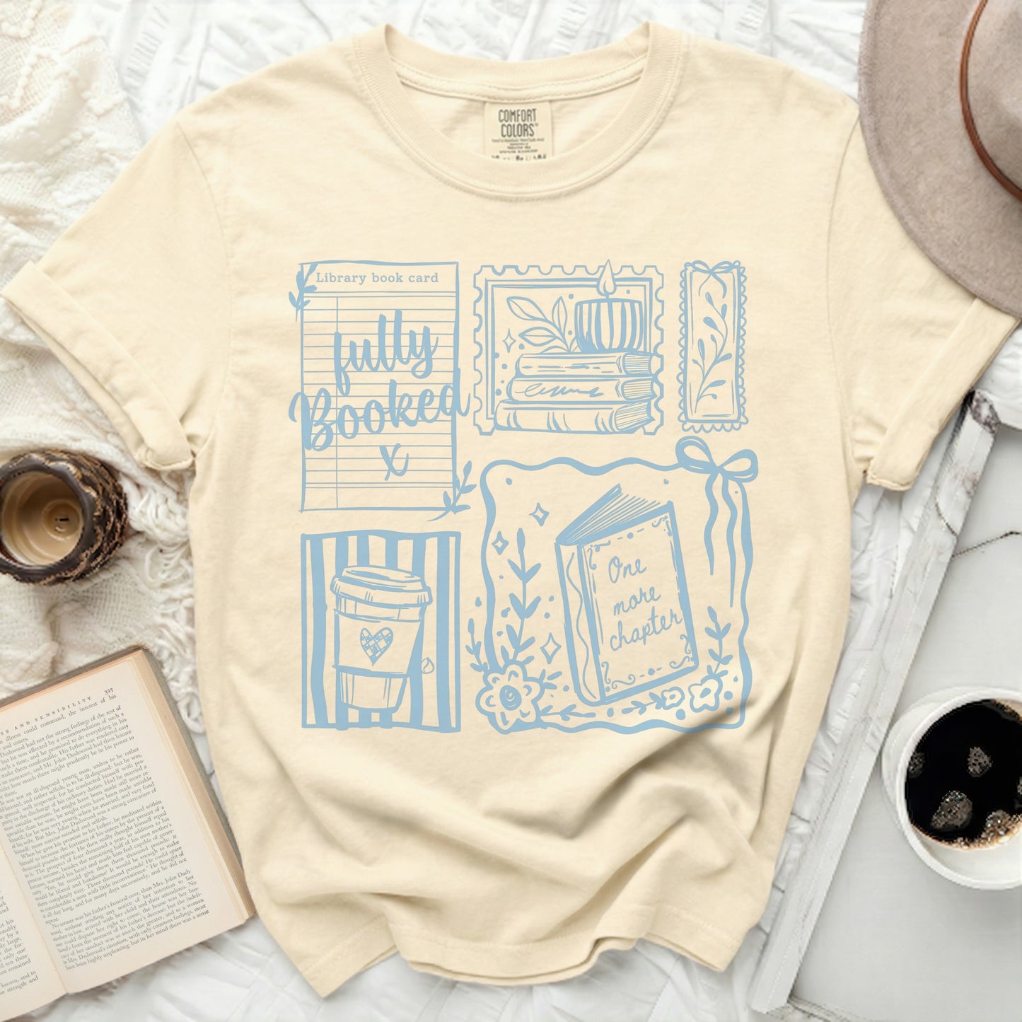 Beige t-shirt with "fully Booked" and library card design.