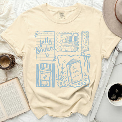 Beige t-shirt with "fully Booked" and library card design.